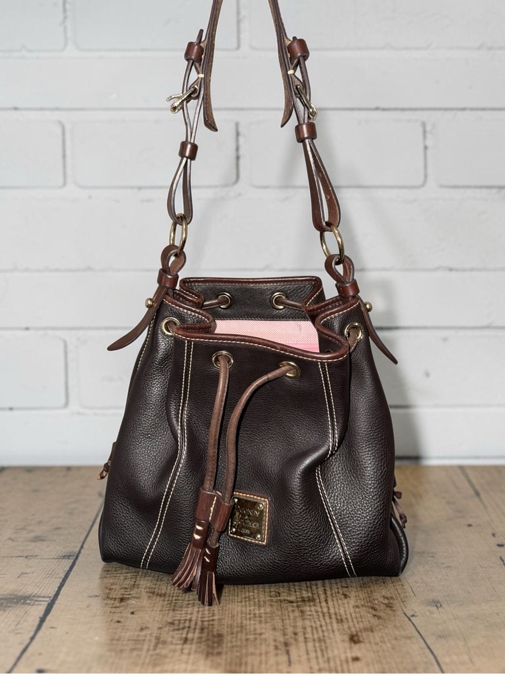 Dooney & Bourke Dark Brown Leather Drawstring Shoulder Bag with Pink Lining